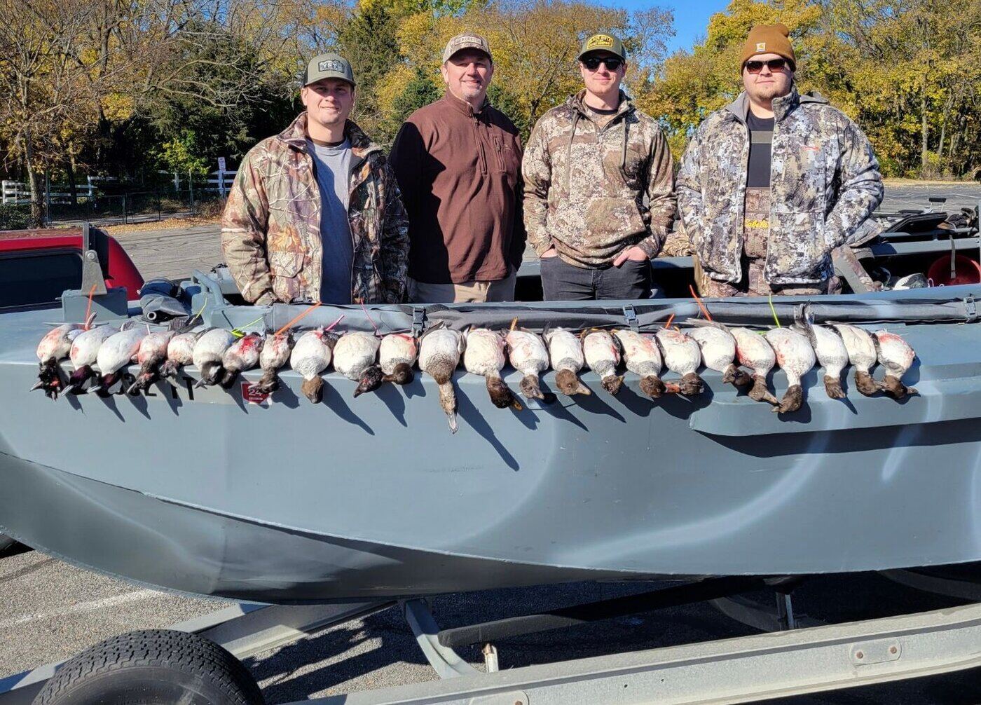 Lake Erie duck hunters working a flight of divers from a fully-blinded Duckwater boat on a Huckeye Charters standard non-specific species duck hunt